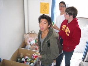 Crescenta Valley High School students carry donated items for the school’s annual canned food drive. The items were distributed to local families in need. Photo by Peter LEE  