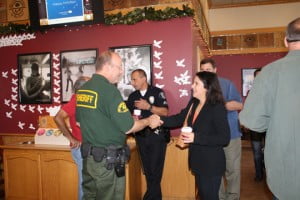 Crescenta Valley Sheriff Deputy Eric Matejka (left) and Glendale police Officer Matt Zakarian greet residents at Coffee with the COPPS on Dec. 17 at Coffee Bean and Tea Leaf.  Photo by Mary O’KEEFE 