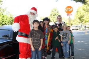 On Dec. 18, Fremont Elementary School students (right) were treated to a limo ride to In and Out for a hamburger and shake with Santa Claus and their principal Cynthia Livingston. The lucky students raised the most funds in the school’s Sally Foster gift wrap fund raiser. They were surprised when they found not only Santa but their principal waiting at the limo. Livingston has been out of school for weeks recovering from a car accident. From left, Santa, Michael Sorokin, Faith Heggie, Anne Bonino-Britsch, Dylan Koch, Livingston, Michael Ruf and Dylan O’Meara.