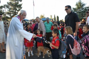 Father Jack Foley blesses the animals at Holy Redeemer Catholic School, just one of the many  events students share at the school.  Photo Mary O’KEEFE