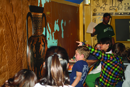 Instructor Derek Gougis (top, standing) explains to Mountain Avenue Elementary School sixth graders about ancient Roman urns. Gougis is with the Ancient World Mobile from the L.A. County Museum of Art.  Photos by Mary O'KEEFE