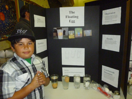 Fourth grade student Jonathan Magna tests for properties of density.