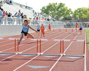 Claudia Sepluveda winning the 100HH.