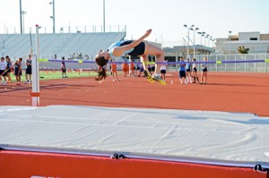 Emily Beglarian winning the high jump (5-0).
