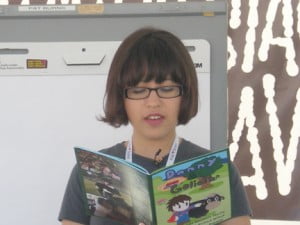 Dani Bowman reads from a book at a recent children’s book fair. Dani Bowman reads from a book at a recent children’s book fair.