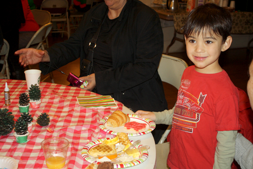 Though Josh Copi, 4, liked the crafts and the fire engine, he really liked the holiday cookies.