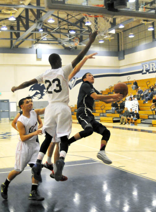Flintridge Prep’s Kyle Hamane (shown here against Cleveland) led the Rebels with 12 points against Verdugo Hills, but the team lost 60-36. The Rebels (2-2) play today, hosting Sierra Canyon at 7:30 p.m. 