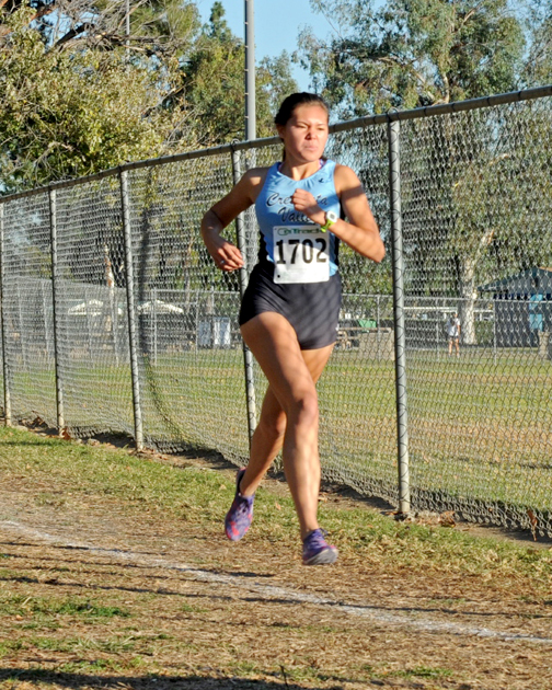 Photos by Leonard COUTIN Falcon leader Grace McAuley placed 12th in the final meet of the regular Pacific League season.
