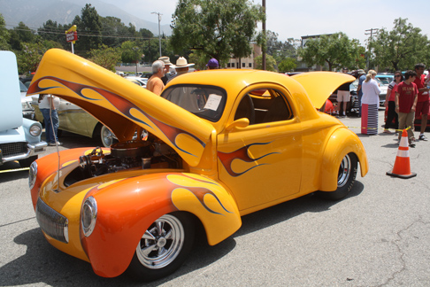 A 1941 Willys Coupe, painted bright yellow with red flames, attracted plenty of attention.