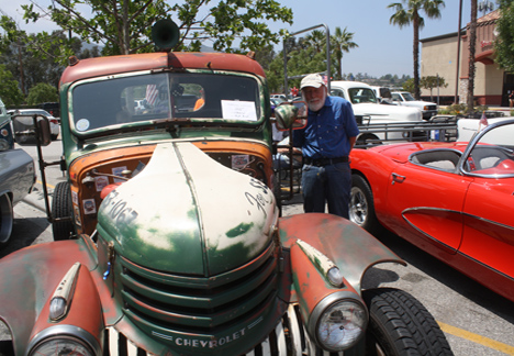 La Crescenta resident Jerry Burnham checks out a 1942 Chevy truck.