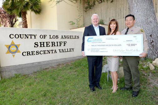 Photo by Bob PAZ From left are Rich Harris, CEFCU president/CEO; Linda Taix-Paccone, president CVSSG; Bill Song, captain, Crescenta Valley Sheriff’s Station.