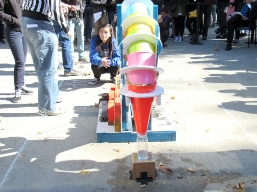 : A student looks over her team’s entry in the challenge.