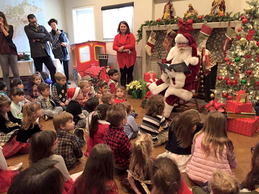 Santa visits and reads to the CCNS children