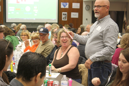 JD Speas of Crescenta Cañada Pet Hospital and a board member of the CV Chamber of Commerce confirms the numbers on a winning bingo card.