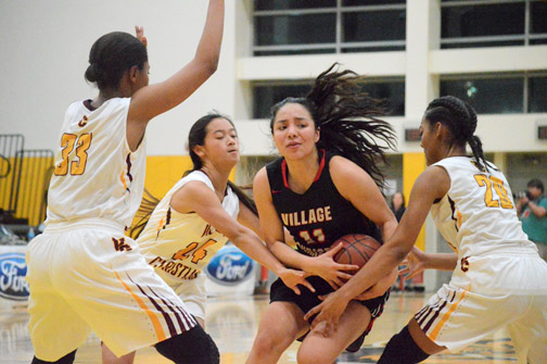 An expressive Leslie Aguilar fights to keep the ball away from the Valley Crusaders during Friday night’s game.