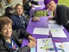 WRAP-Kiwanis-member-Amy-Navarrete-in-hat-signs-in-as-Karen-Swan-and-Monica-Sierra-oversee