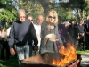 John and Carol Chulluck throw a retired piece of flag into a fire at the Vetrans Memorial Service, Two Strike Park, La Crescenta, Ca. (Photo by Ed Hamilton / nov 11th, 2012)