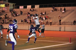 Crescenta Valley’s Mike Bako goes high to receive a pass. Bako’s performance helped propel the Falcons to a 41-12 victory of the Tornadoes.