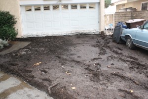  Alice Khatchooni came home to a driveway and backyard buried in mud after Thursday night's unexpectedly powerful rainstorm hit the Crescenta Valley.