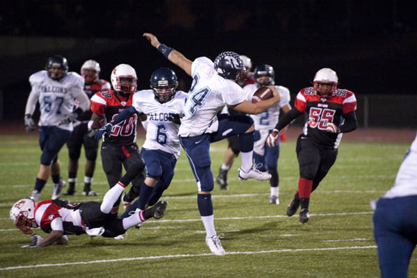 CVHS Falcon Harry Pessy makes an impressive vault over the defense on his way to a touchdown. Photos by Greg COOK 