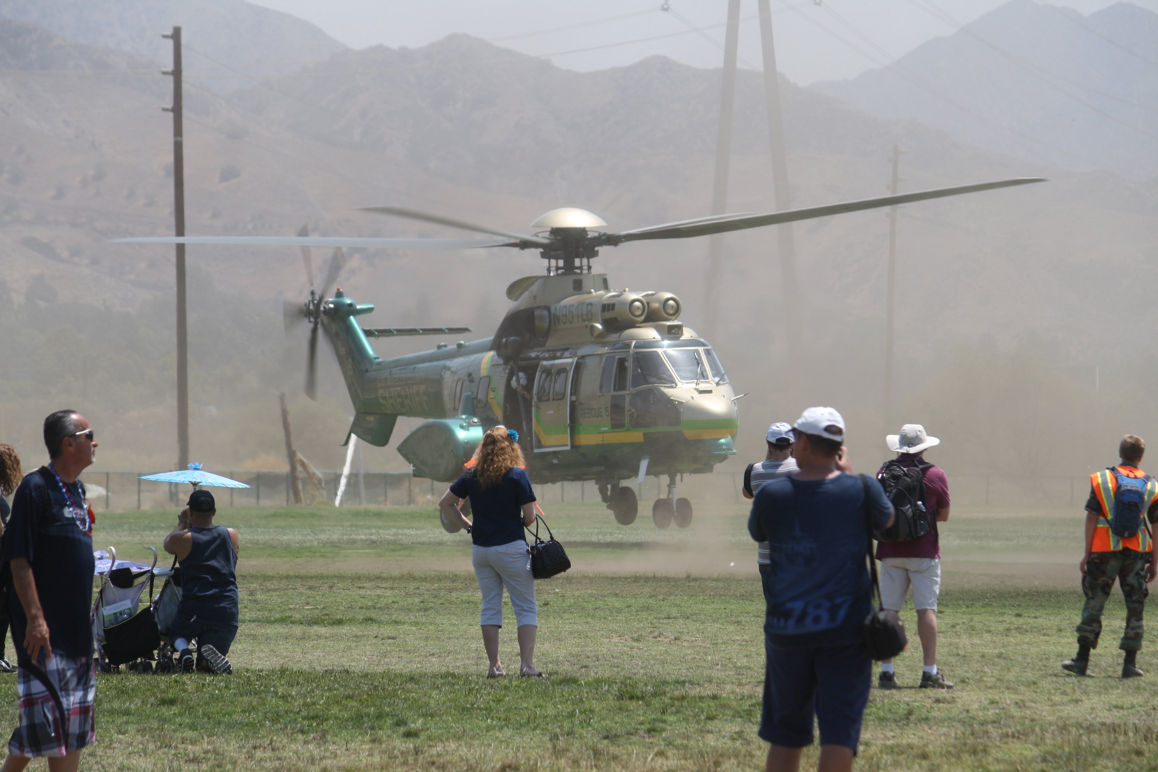 Photo by Michael YEGHIAYAN Attendees at Saturday’s American Heroes Air Show watch as L.A. Sheriff’s Air Rescue 5 lands at Hansen Dam. Helicopters Arrive at Hansen Dam