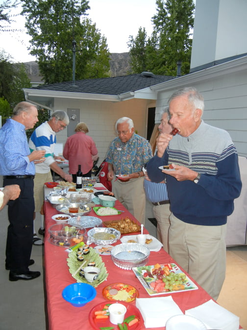 “Official” taster Bob Neilson leads the attack on the hors d’oeuvres.