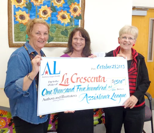Photos provided by Karen SAUNDERS Karen Saunders, chairman of Authors and Illustrators, presents a check to Kim Bishop (center), principal of La Crescenta Elementary School, with the help of Karen Millman, president of Assistance League Glendale.