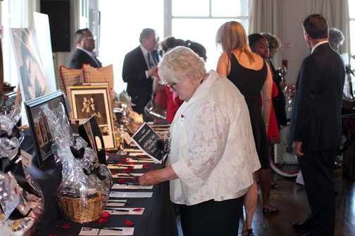 Guests place bids on items in the silent auction.