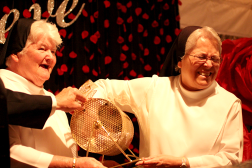 Principal Sister Celeste Marie Botello, O.P. selects the winner of the cash raffle. FSHA’s Magical Night on the Hill