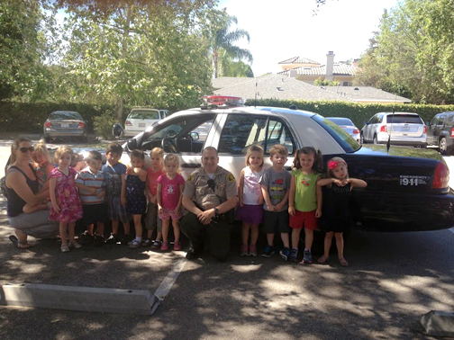 Students from LCFCCP receive lessons in “stranger danger” and safety from Deputy Dan Cortes.