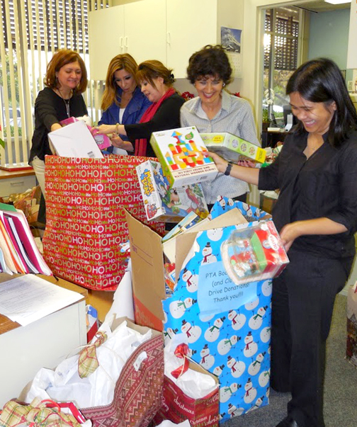 Healthy Start members go through the donated toys.