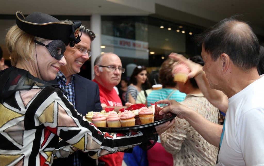 Photos provided by GAMC An entertainment performer serves cupcakes with Kevin A. Roberts, GAMC president/CEO, to guests at the Glendale Galleria during Sunday’s 110th birthday celebration.