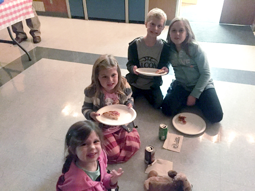 Movie Night V V students enjoying pizza and drinks before the movie