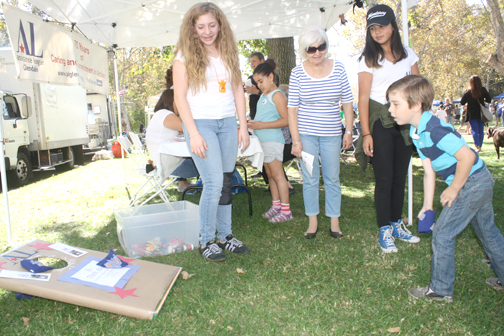 Daniel Missakian, 6, who attends Mark Keppel Elementary School, tried his luck at the bean bag toss provided by the Assistance League of Glendale.