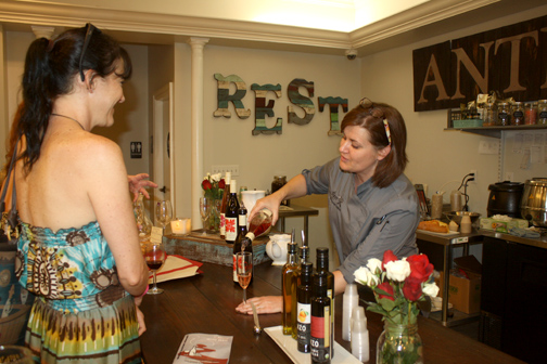 Kristina Evans of Farmhouse Rest pours a taste for Teri Madsen.