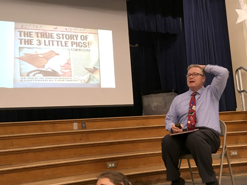 Principal, Dr. Reynolds reading his favorite story