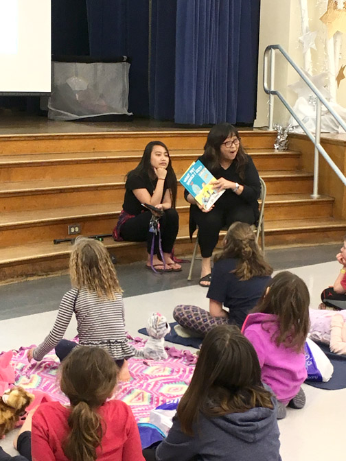 Valley View librarian, Mrs. Maribel Sibulo, reads a Dr. Seuss book