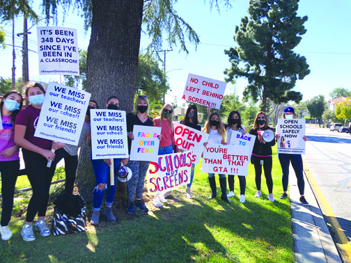 Parents Wanting Schools to Reopen Protest Outside GTA Office
