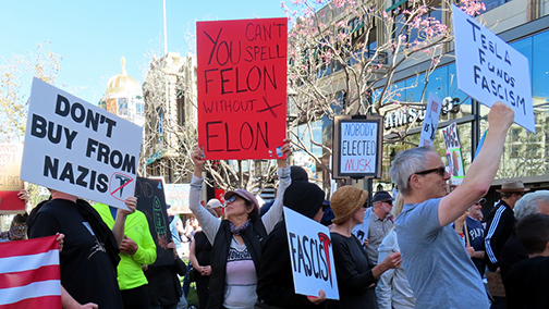 Protests Take Place Near Local Tesla Dealership
